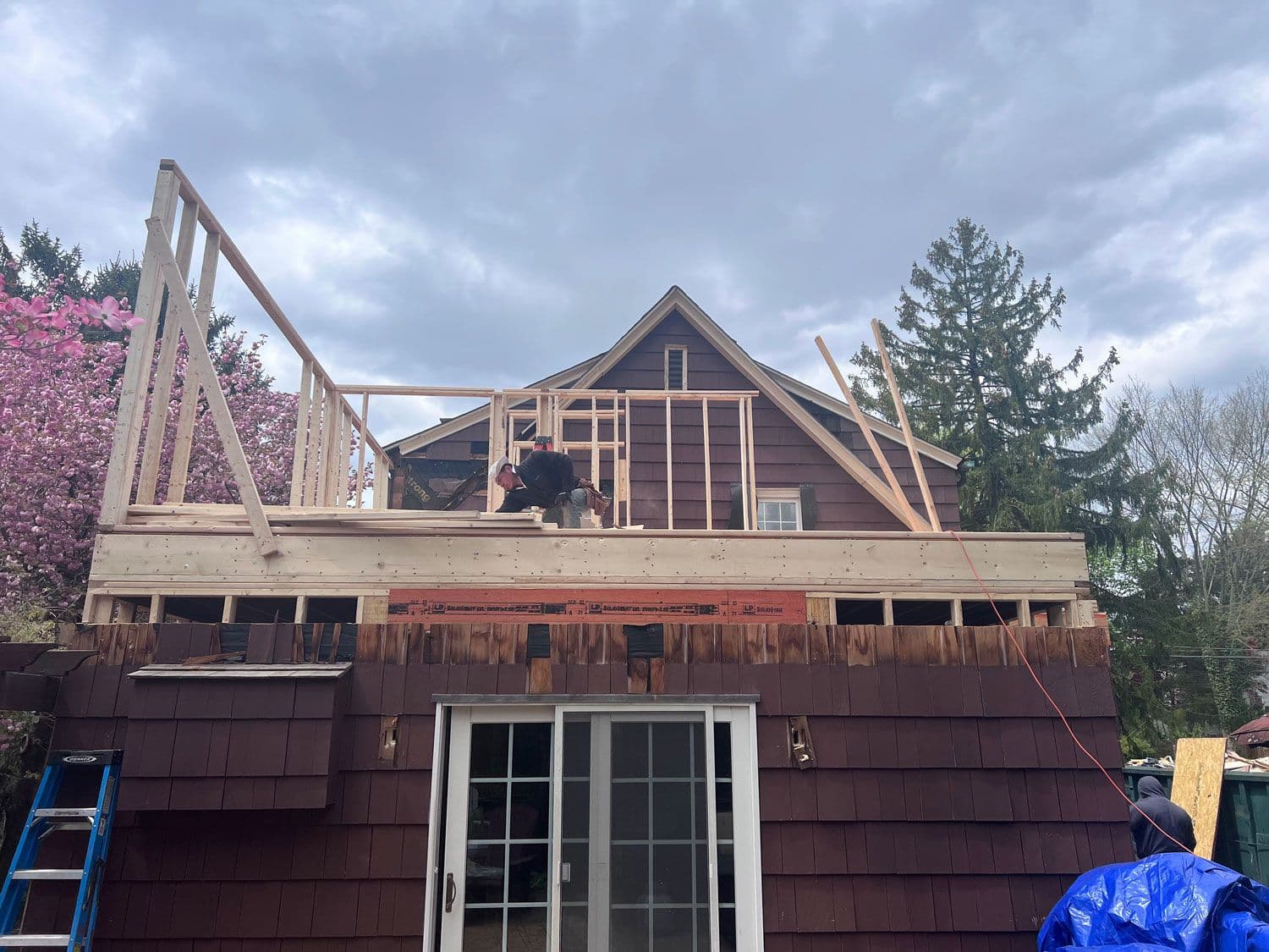A second-storey addition being framed above an existing roof