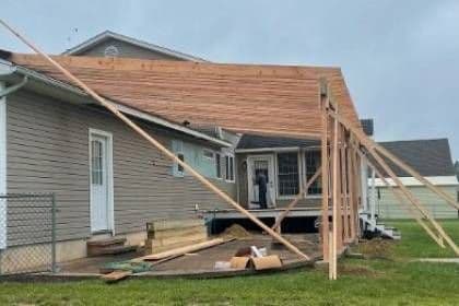A new addition framed and braced against the side of a house