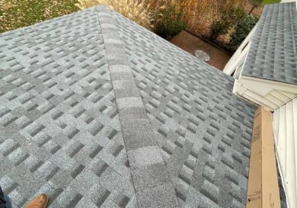 Newly laid GAF architectural shingles seen close up on a finished roof